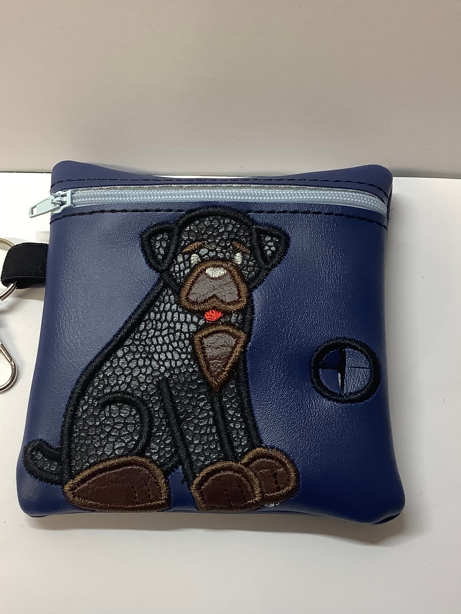 Rottweiler poo bag dispenser on Blue Embroidered Bag