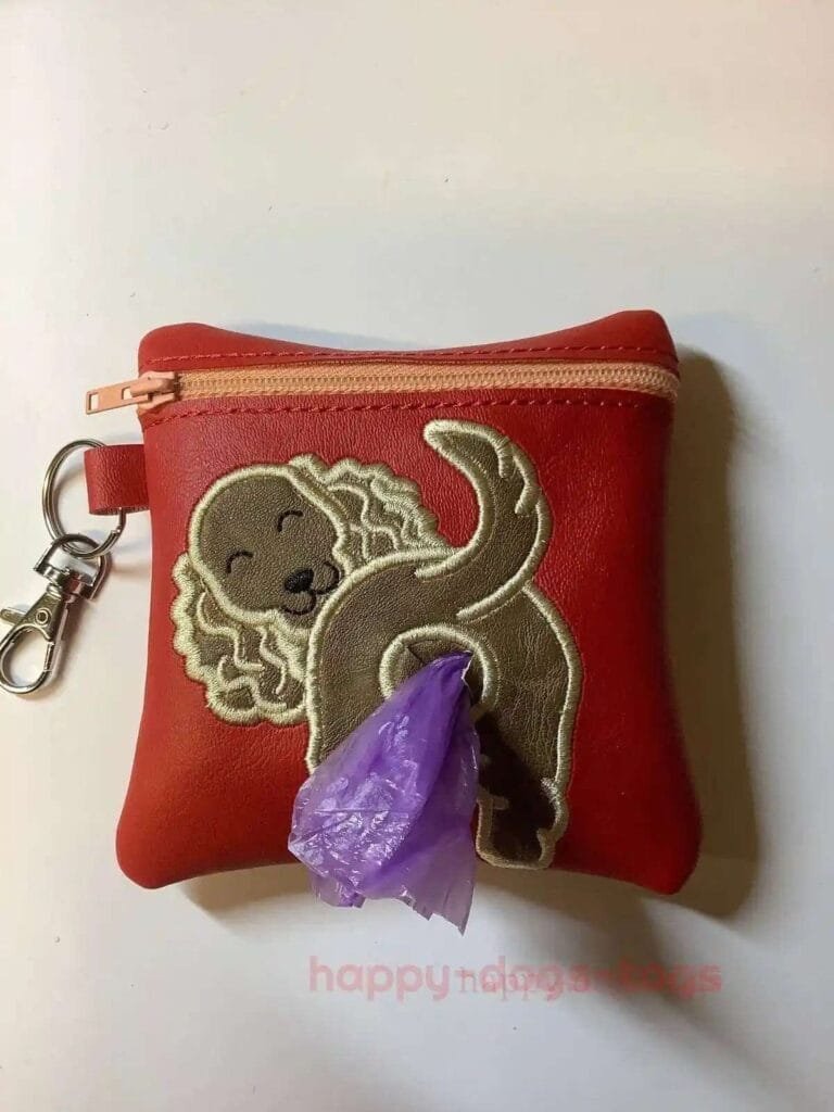 Embroideredpoobagdispenserfawnspanielonredbag Happy Dogs Togs1