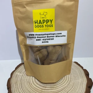 A Bag Of Banana 7 Peanut Butter Biscuit Treats On A Piece Of Wood